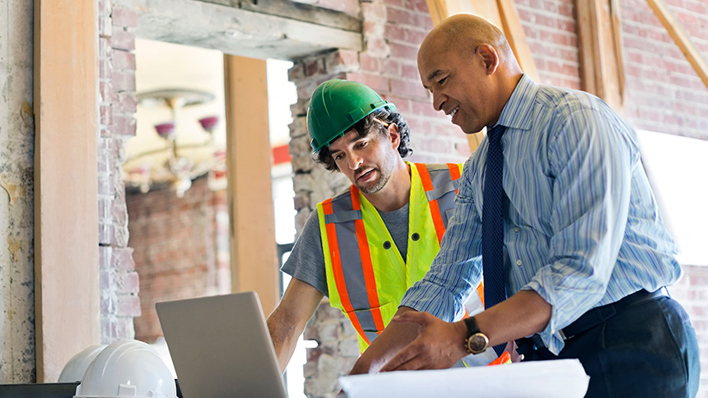 construction plans two men