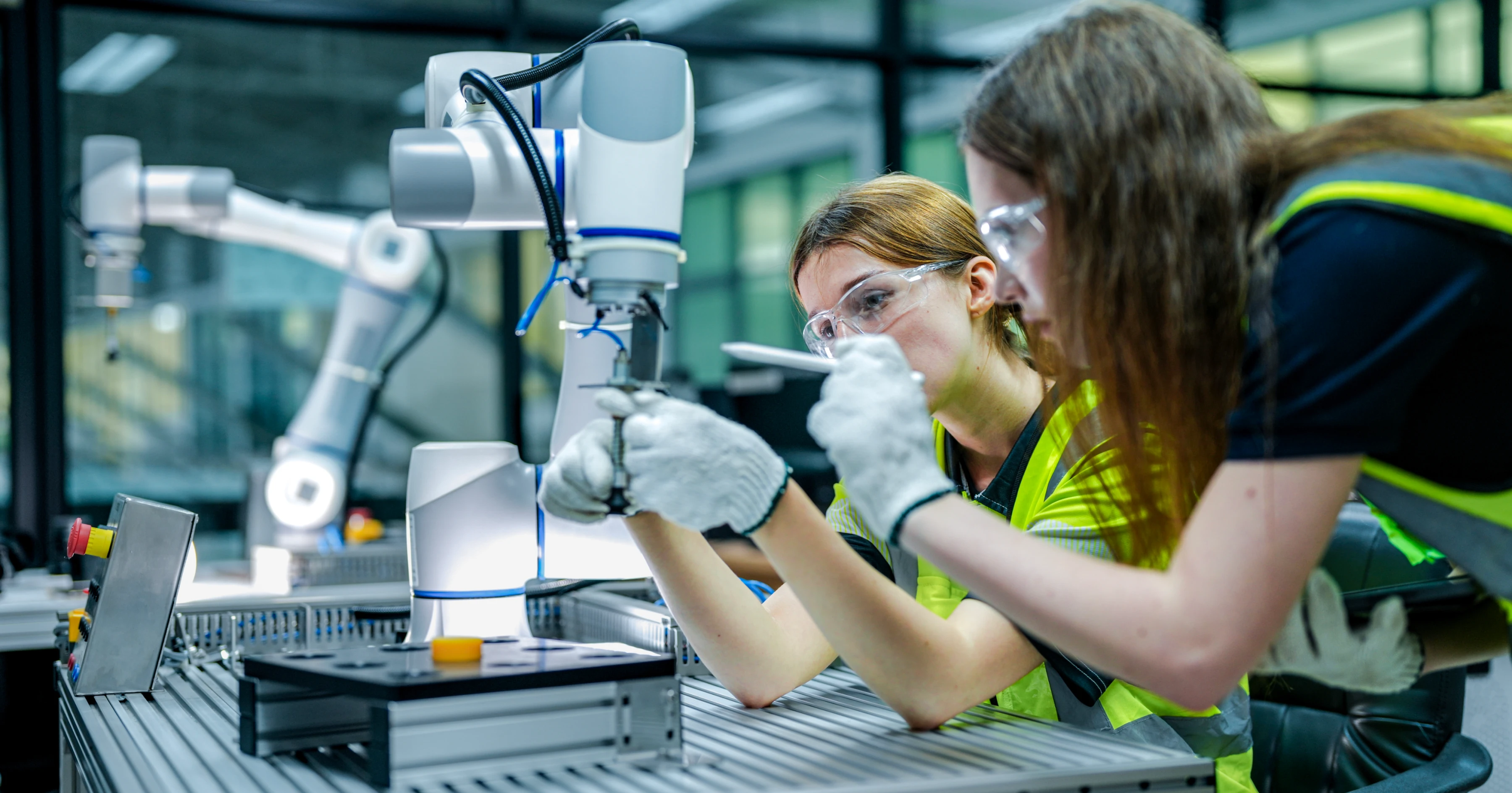 workers using robotics in lab