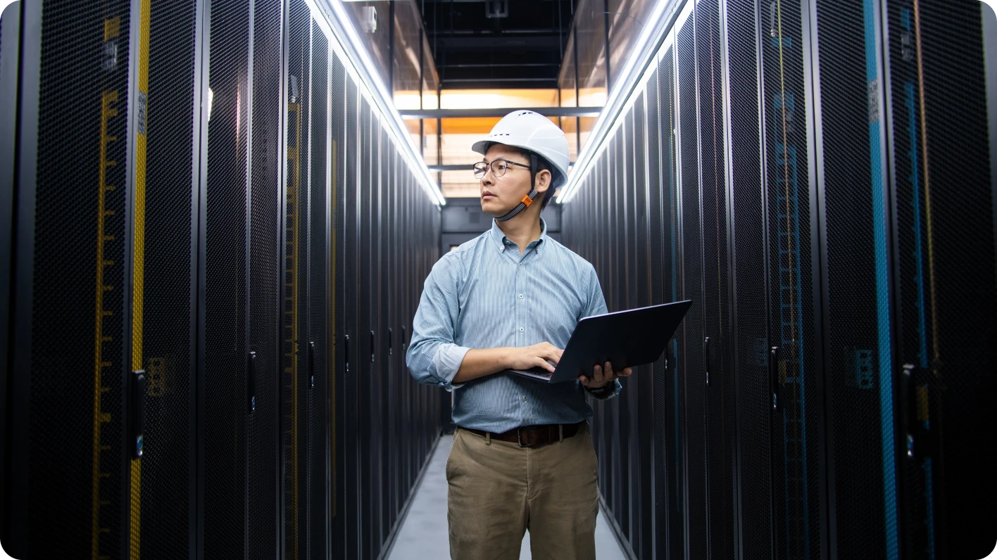 Engineer maintaining critical systems in a modern data center during rapid data center infrastructure growth.