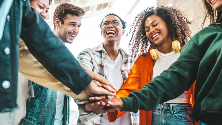 Face of the Future of Manufacturing: a circle of young people of mixed ethnicities