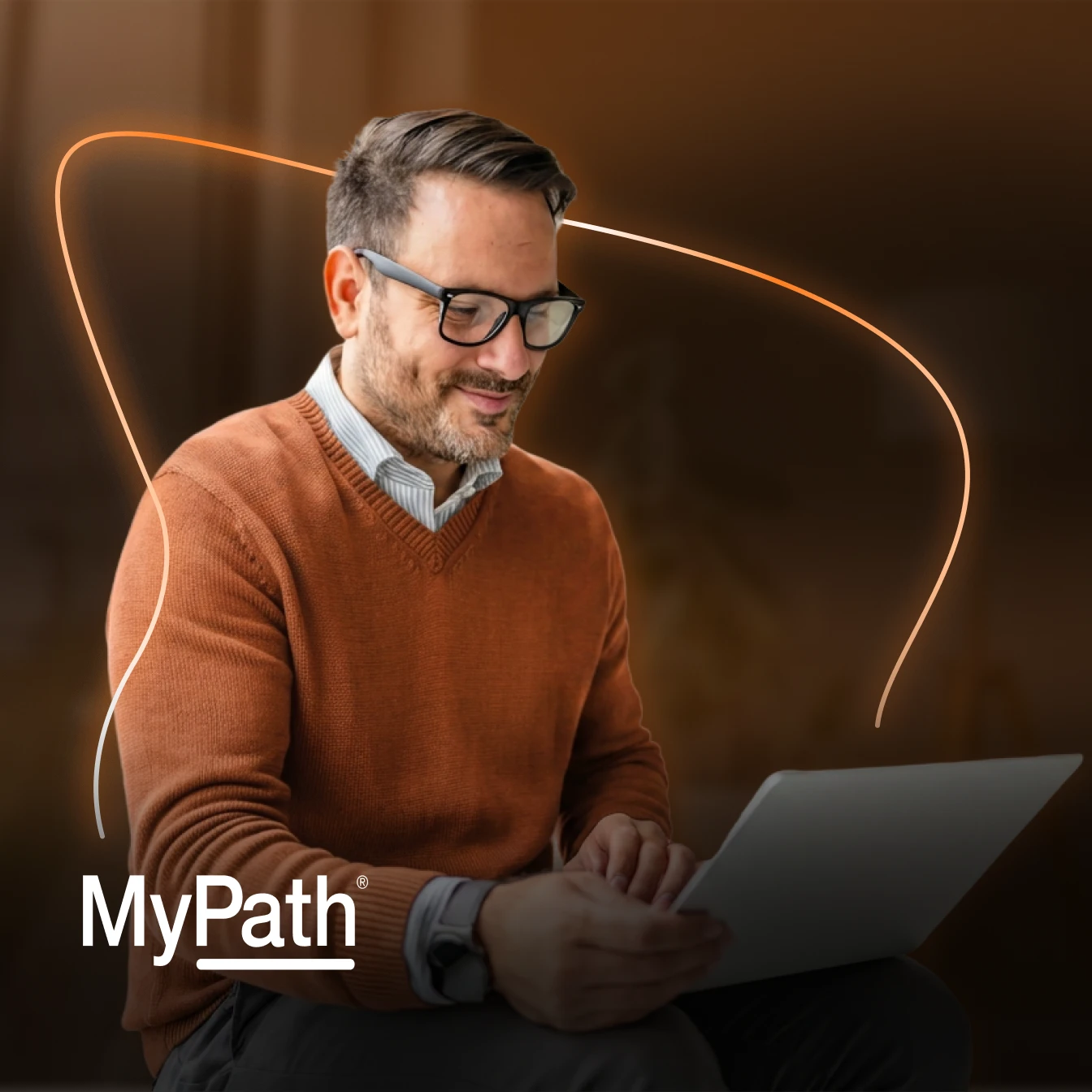 man working on laptop smiling